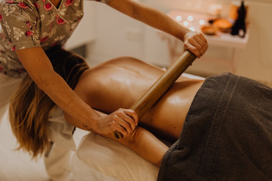 Professional therapist performing aromatherapy massage treatment at a Nashik spa