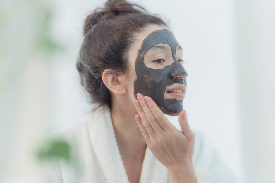 Esthetician performing charcoal facial treatment in Nashik spa
