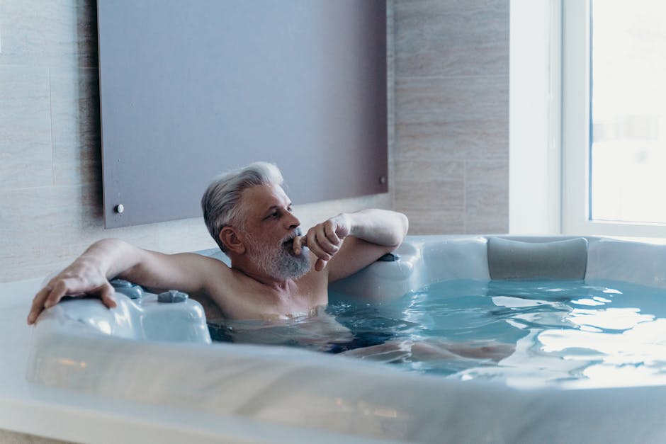 Person relaxing in a therapeutic jacuzzi bath with healing water jets in Nashik spa