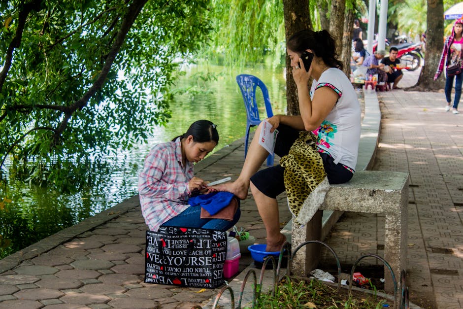 Heated basalt stones placed on feet during stone pedicure treatment